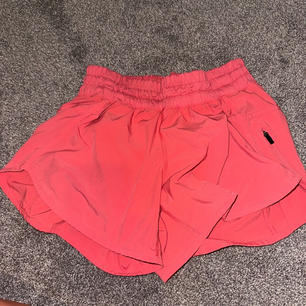 Coral/Pink color lululemon shorts